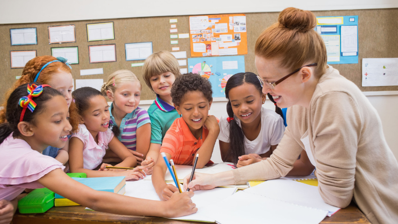 Teacher teaching students in classroom