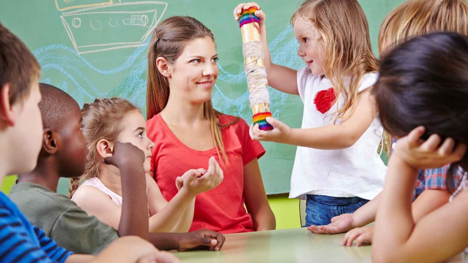 Kindergarten teacher with students in classroom