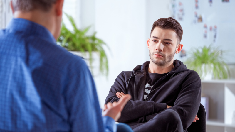 Man speaking with mental health counselor