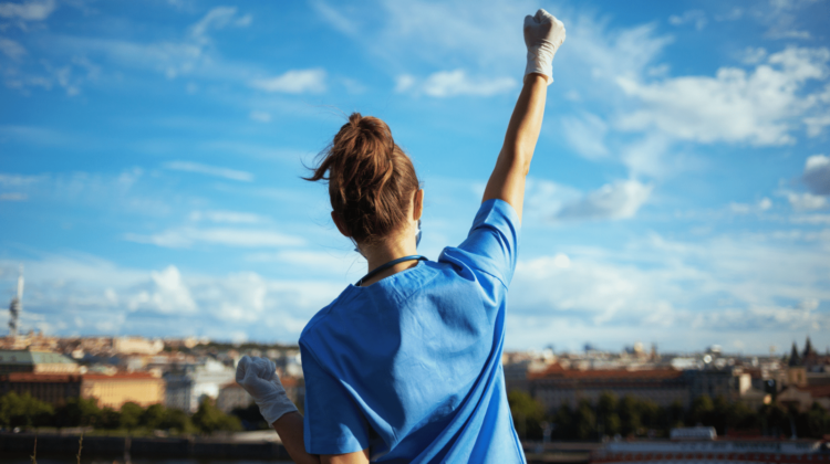 Happy Nurse Celebrating Outside