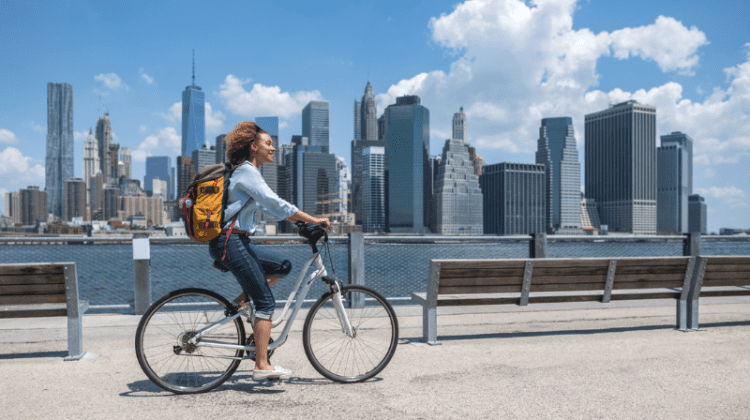 Female Student biking in New York