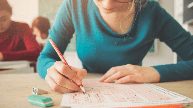female student taking a final exam