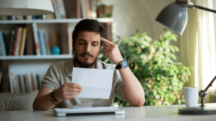 college student reading acceptance letter
