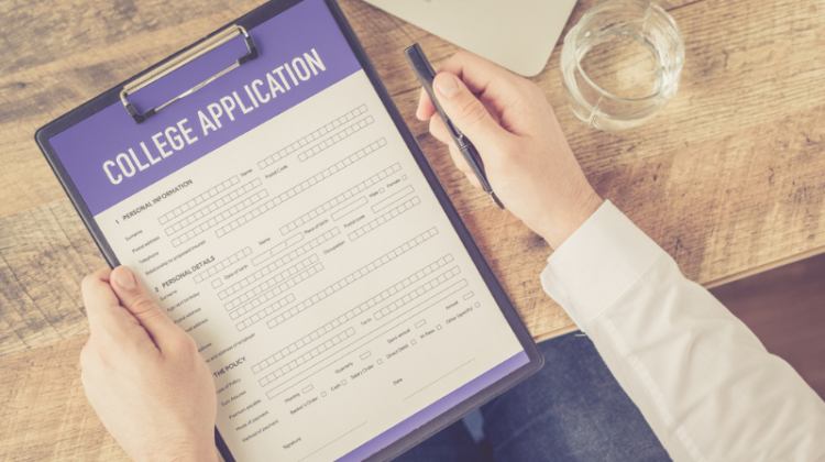 student completing college application